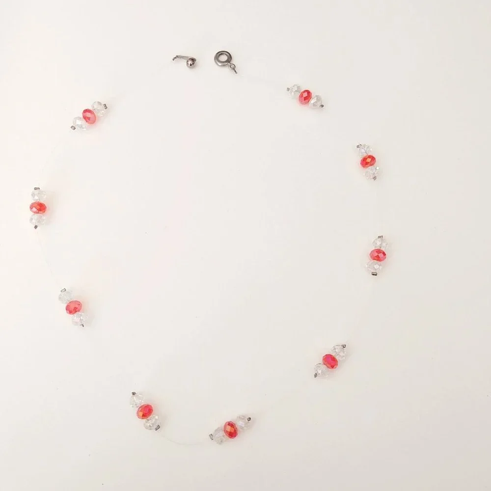 Floating clear and orange crystal necklace